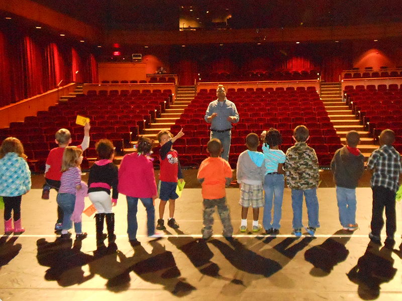 Mr. Marty talking to students about the theatre.