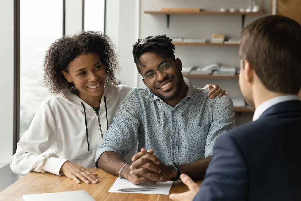 black couple meeting with an advisor