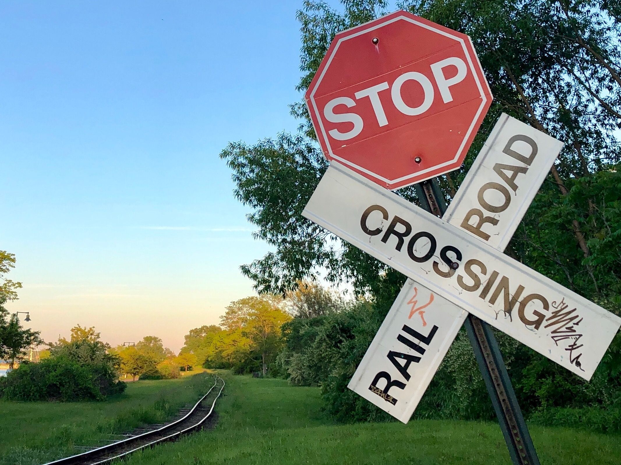 Stop sign at railroad tracks