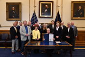 Rogers' legislation to simplify pensions processes and address property taxes ceremonially signed by governor
