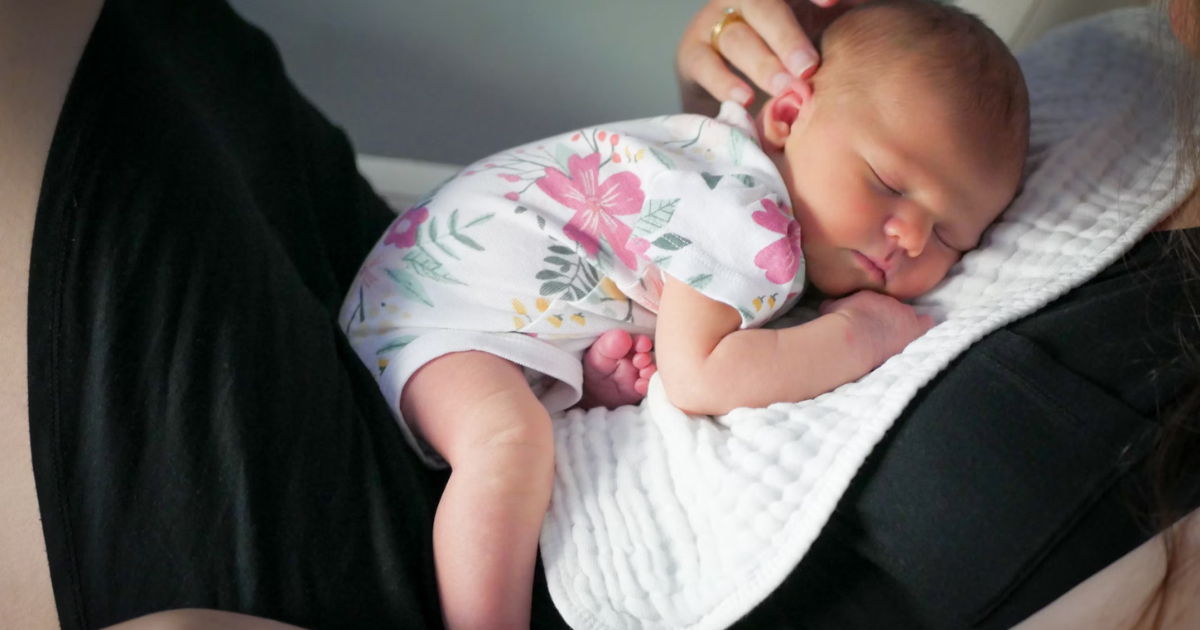 Infant resting on mother Infant resting on mother