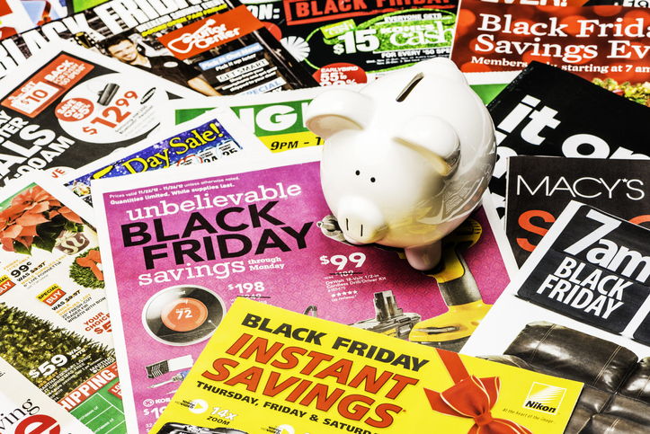 Piggy Bank sitting on Black Friday Ads