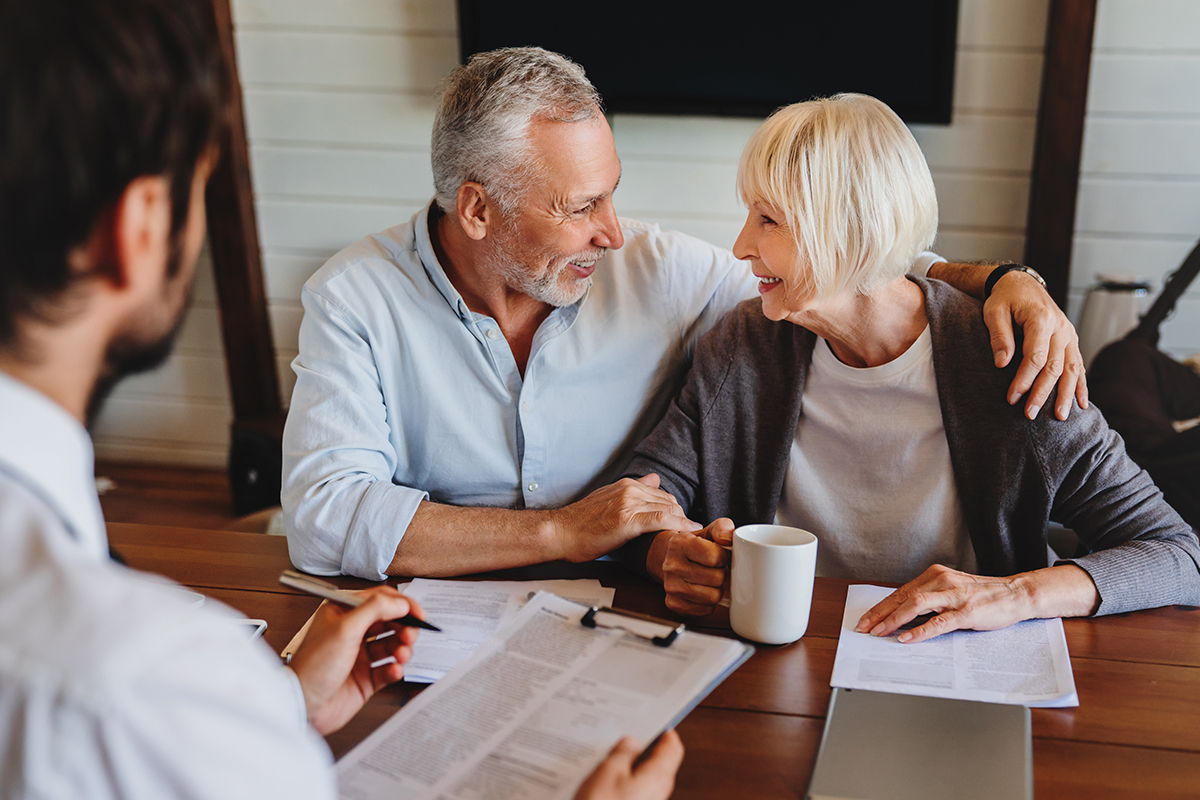 older couple in meeting smiling