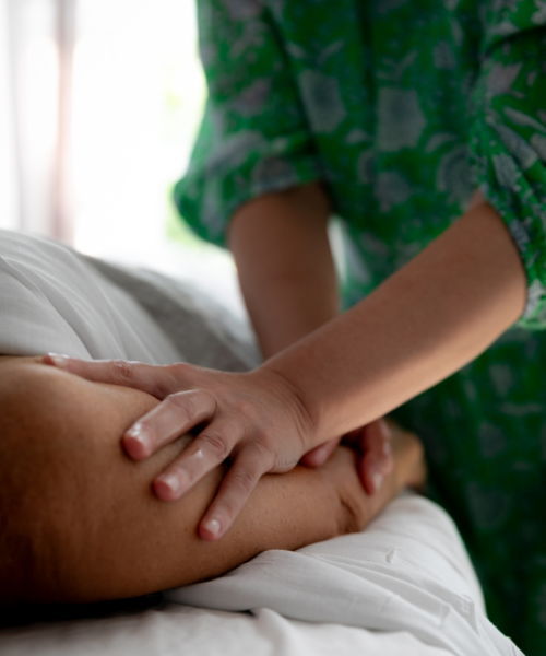 holistic therapeutic massage jackie massaging a client's arm