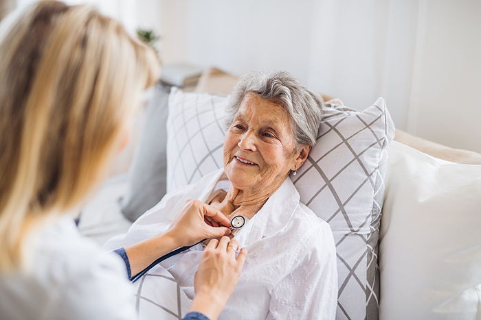 elderly woman with nurse